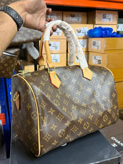The Signature Barrel Bag